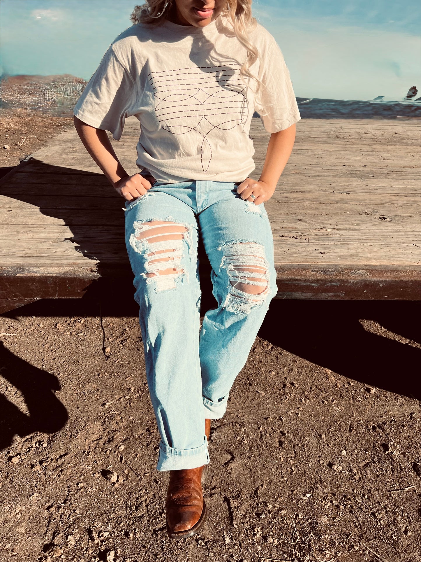 Wrangler light wash, distressed denim