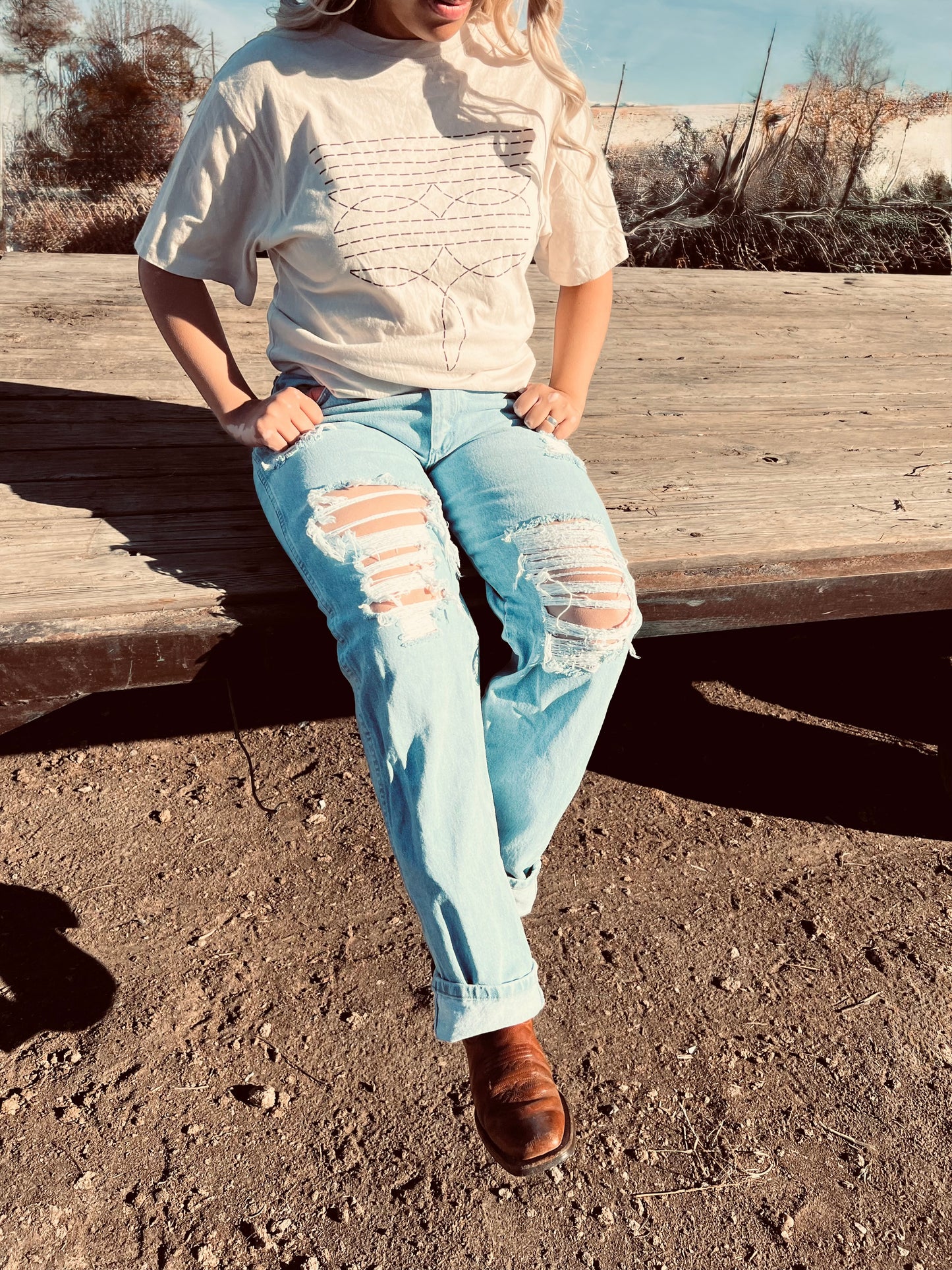 Wrangler light wash, distressed denim
